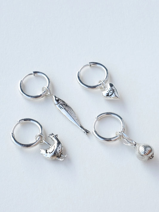 Sterling silver mono earrings on ear - all four designs