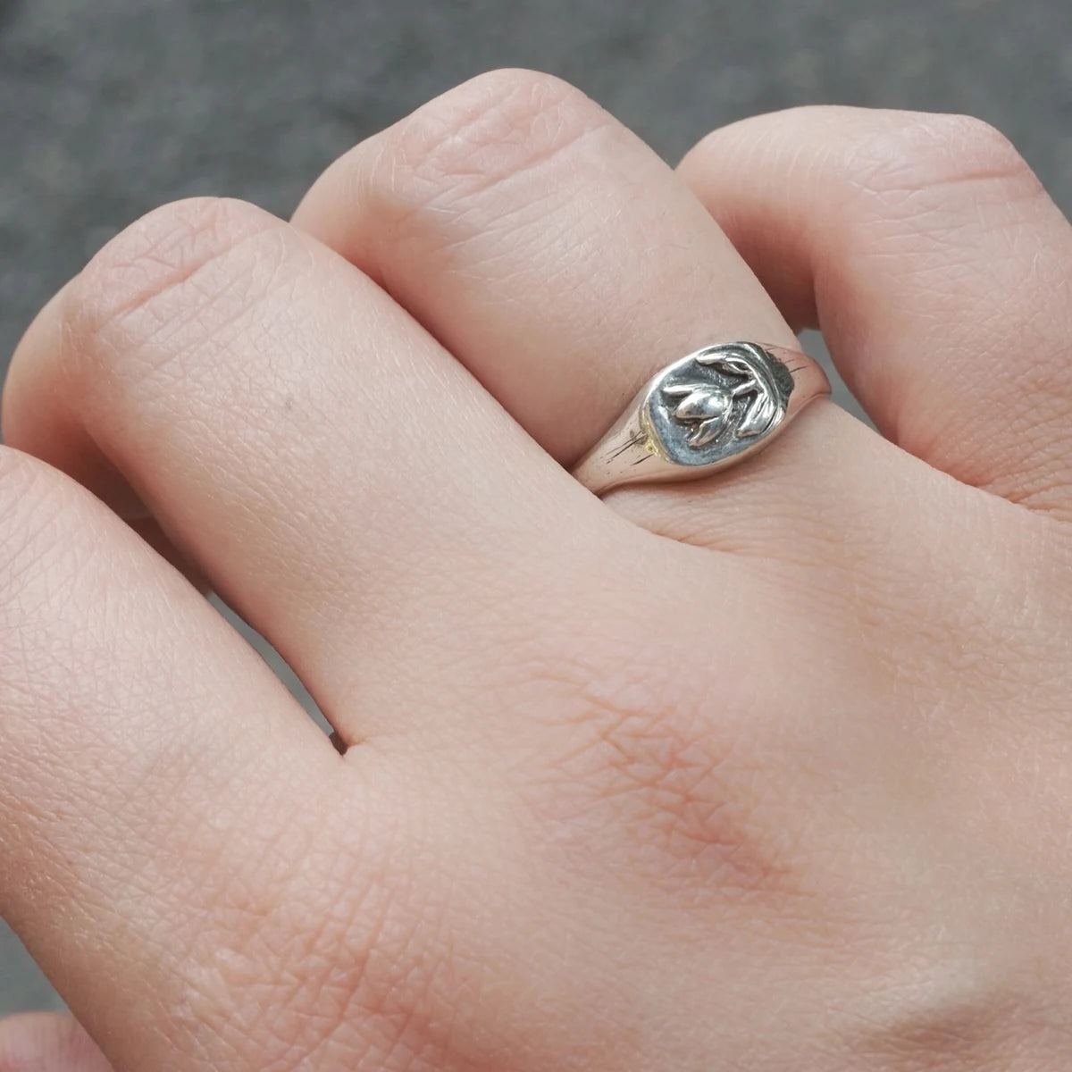 Stalyi Tiulpan handmade sterling silver tulip ring worn on hand, close-up