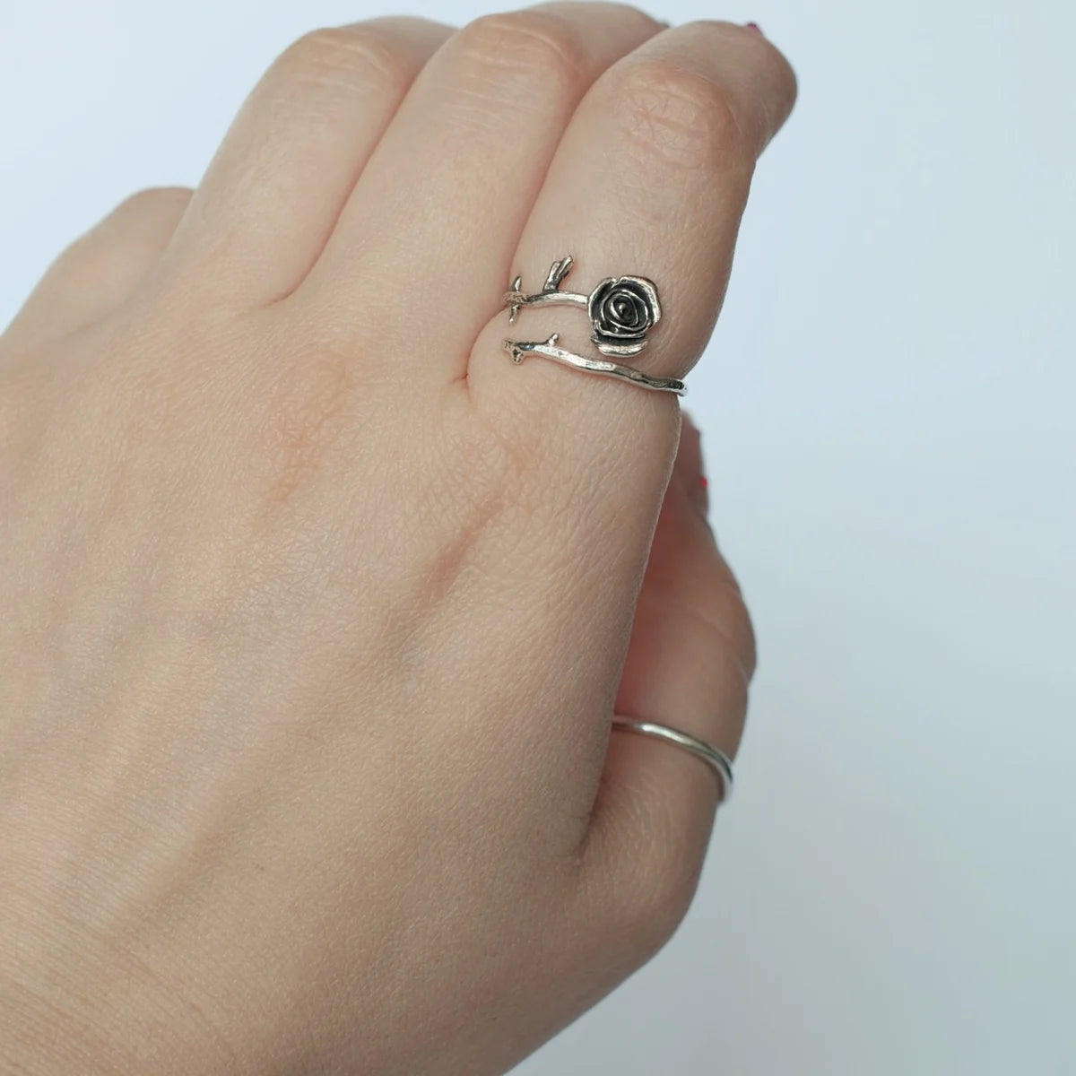Troianda Koliucha adjustable sterling silver rose ring worn on hand