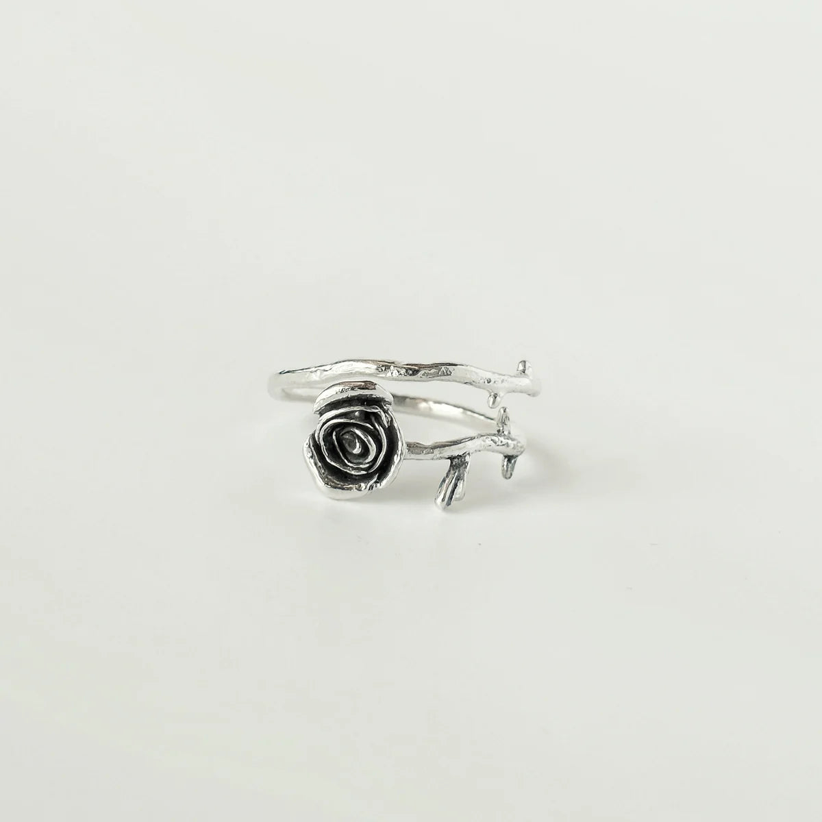 Troianda Koliucha handmade adjustable sterling silver rose ring, front view